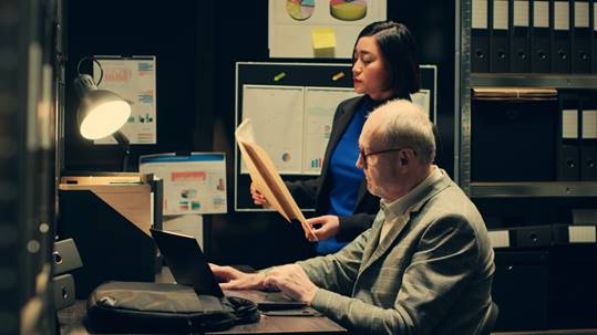 Woman talking to a man in office - Wrongful Termination